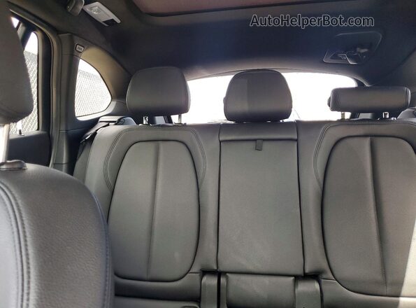 WBXHT3C34G5E52411 2016 BMW X1 Silver Rear seats view