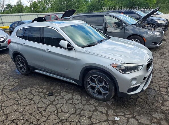 WBXHT3C34G5E52411 2016 BMW X1 Silver Front right