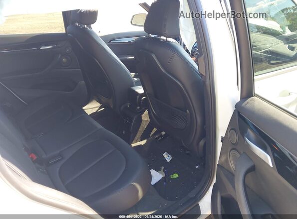 WBXHT3C34G5F64884 2016 BMW X1 White Vista de la etiqueta del VIN