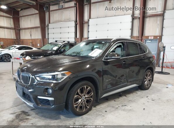 WBXHT3C34H5F85641 2017 BMW X1 Коричневый Передняя левая четверть
