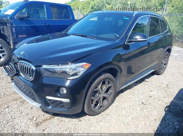 WBXHT3C34J5L30832 2018 BMW X1 Black Vista tres cuartos delantera izquierda