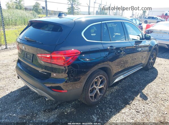 WBXHT3C34J5L30832 2018 BMW X1 Black Trasero derecho