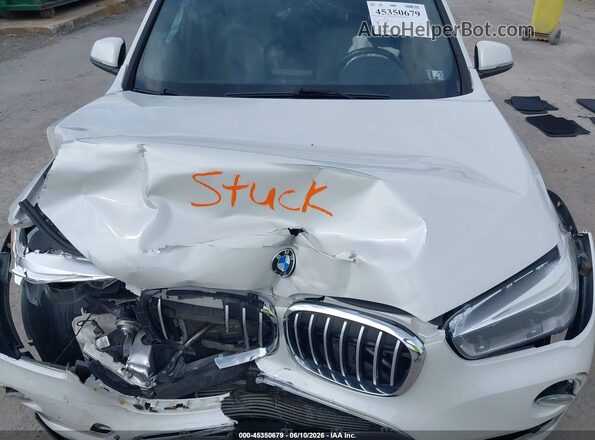 WBXHT3C35H5F73398 2017 BMW X1 White Rear view