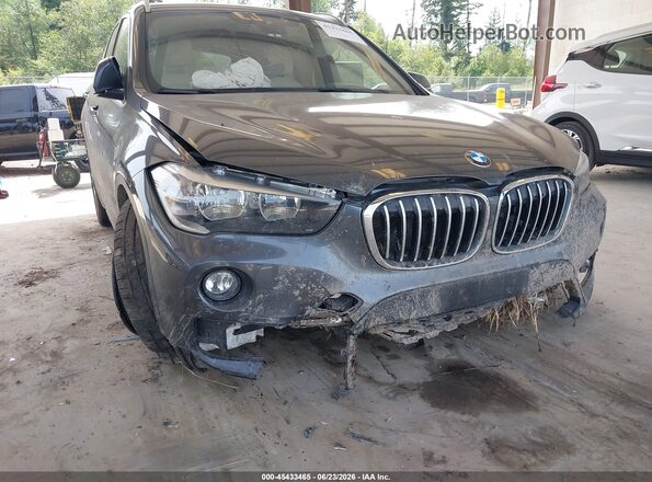 WBXHT3C35J5F89879 2018 BMW X1 Gray Vista frontal