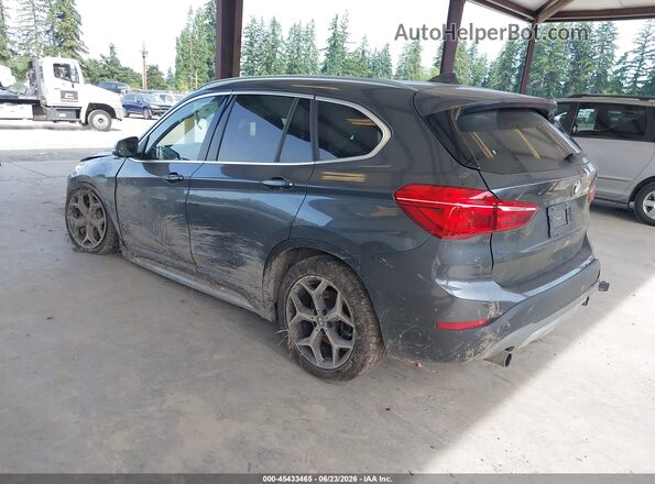 WBXHT3C35J5F89879 2018 BMW X1 Gray Trasero izquierdo