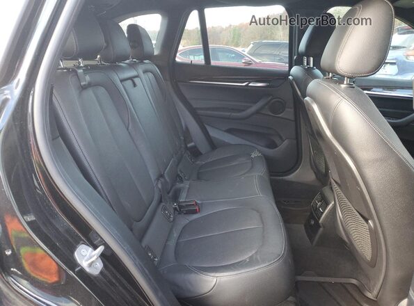 WBXHT3C36G5E50725 2016 BMW X1 Black Вид задньої частини салону