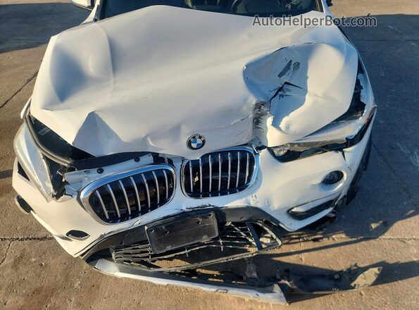 WBXHT3C36H5F70106 2017 BMW X1 White Սալոնի հետևի տեսք
