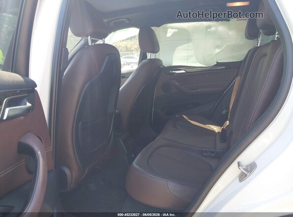 WBXHT3C36H5F77704 2017 BMW X1 White VIN კოდის სტიკერის ხედი