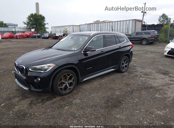 WBXHT3C37G5E49096 2016 BMW X1 Black წინა მარცხენა ხედი სამი მეოთხედიდან