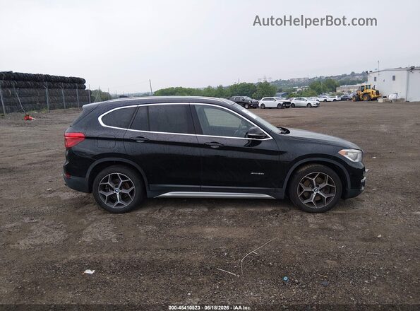 WBXHT3C37G5E49096 2016 BMW X1 Black უკანა სალონის ხედი