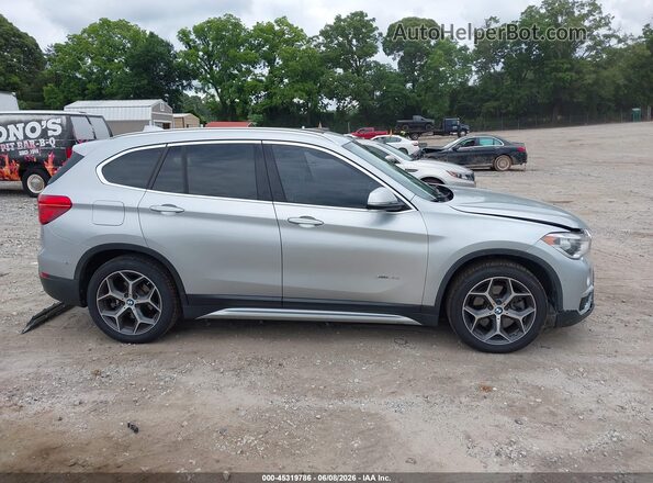 WBXHT3C37GP881883 2016 BMW X1 Silver Սալոնի հետևի տեսք