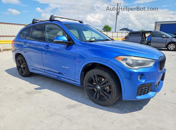 WBXHT3C37H5F80031 2017 BMW X1 Blue Front right