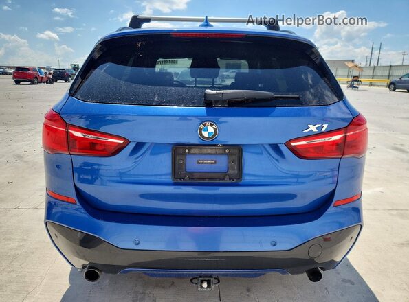 WBXHT3C37H5F80031 2017 BMW X1 Blue Rear view