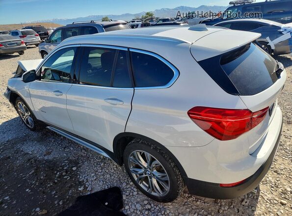 WBXHT3C37H5F82412 2017 BMW X1 White Rear left