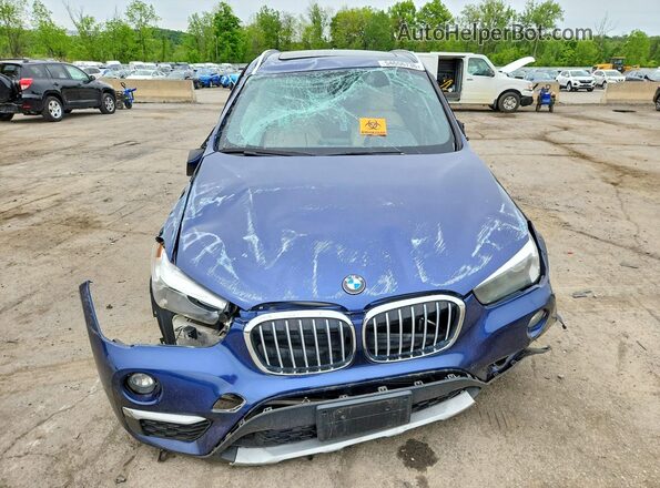 WBXHT3C38G5E53397 2016 BMW X1 Blue Vista frontal