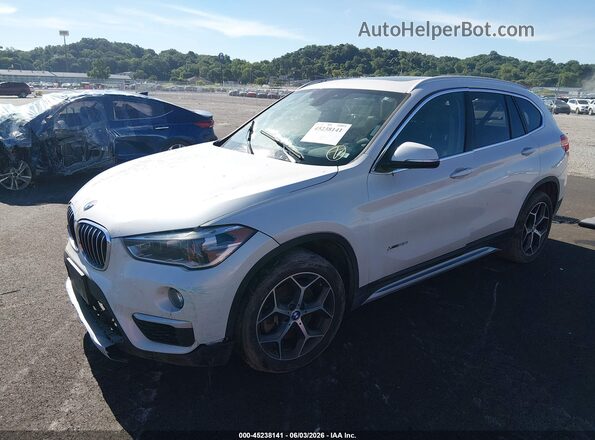WBXHT3C38J5F90086 2018 BMW X1 White Vista tres cuartos delantera izquierda