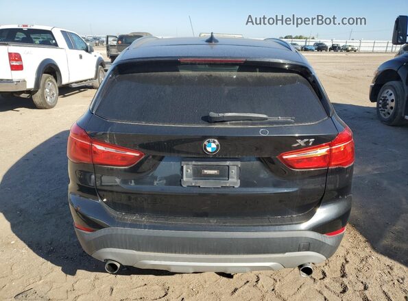 WBXHT3C39G5E51433 2016 BMW X1 Black Հետևի տեսք