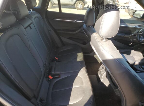 WBXHT3C39G5E51433 2016 BMW X1 Black Սալոնի հետևի տեսք
