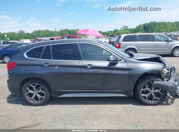 WBXHT3C39G5E52761 2016 BMW X1 Gray Սալոնի հետևի տեսք