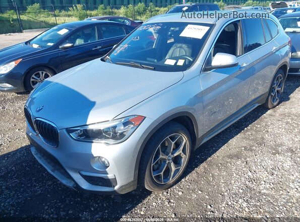 WBXHT3C39H5F69483 2017 BMW X1 Серебряный Передняя левая четверть