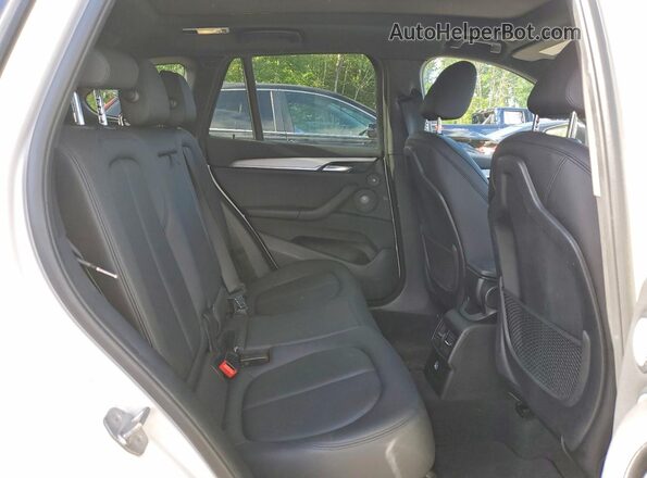 WBXHT3C39J5F88623 2018 BMW X1 White Rear seats view