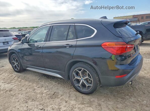 WBXHT3C3XH5F75129 2017 BMW X1 Black Rear left