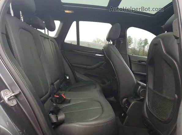 WBXHT3Z33H4A54010 2017 BMW X1 Gray Vista de los asientos traseros