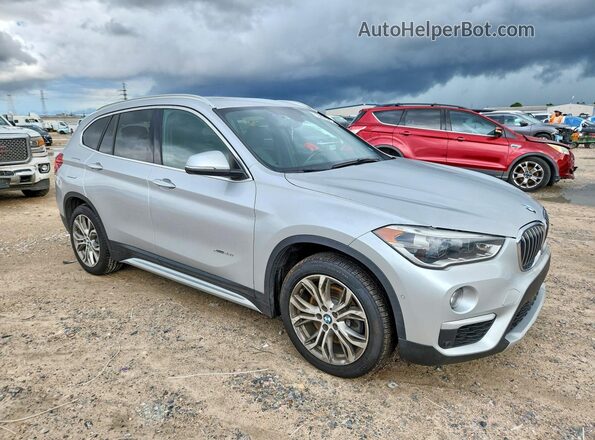 WBXHT3Z34H4A57871 2017 BMW X1 Серебряный Передняя правая четверть