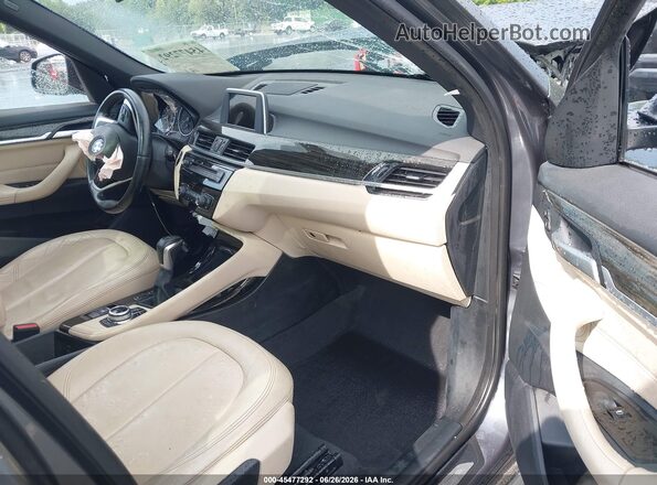 WBXHT3Z36G4A49608 2016 BMW X1 Gray Вид салону спереду