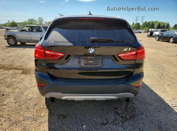 WBXHT3Z37G4A51304 2016 BMW X1 Black Հետևի տեսք