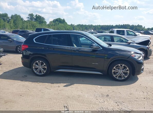 WBXHT3Z38H4A57002 2017 BMW X1 Black Widok wnętrza z tyłu