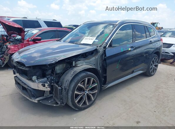 WBXHU7C31H5H37699 2017 BMW X1 Gray Առջևի ձախ երեք քառորդ տեսարան