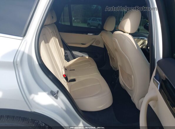 WBXHU7C32J5H40701 2018 BMW X1 White VIN sticker view