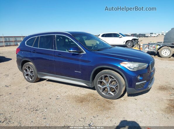 WBXHU7C32J5H44523 2018 BMW X1 Blue Vista interior trasera