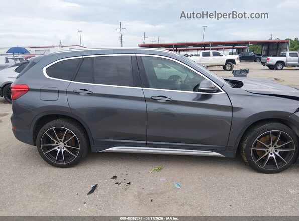 WBXHU7C35H5H34188 2017 BMW X1 Gray Սալոնի հետևի տեսք
