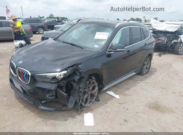 WBXHU7C37J5L05931 2018 BMW X1 Black Առջևի ձախ երեք քառորդ տեսարան