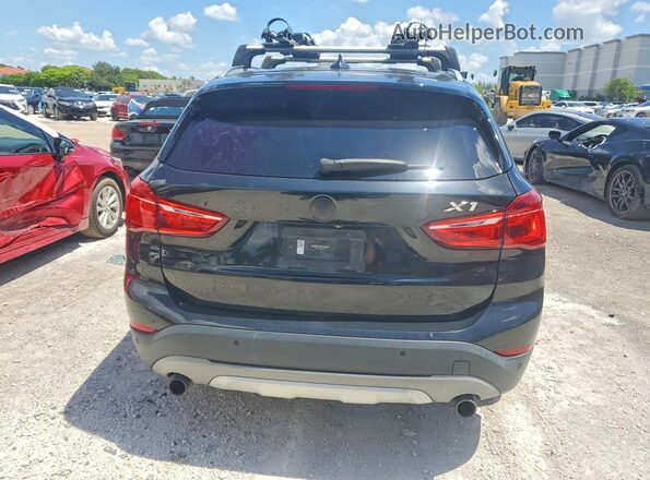 WBXHU7C38H5H37568 2017 BMW X1 Black Rear view