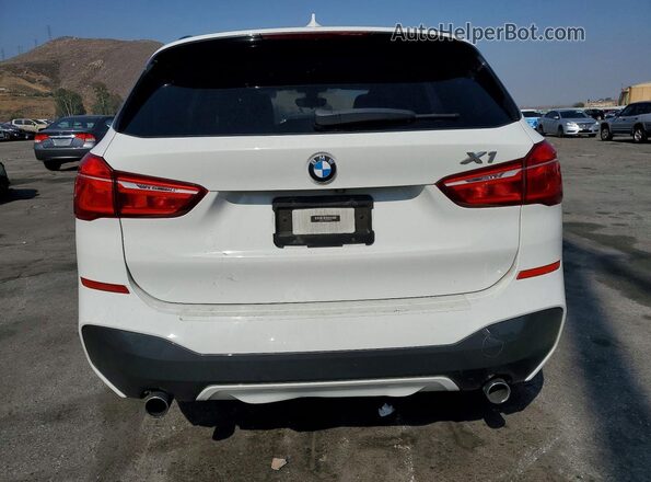 WBXHU7C39J5H39769 2018 BMW X1 White Rear view
