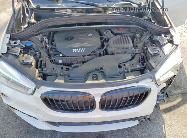 WBXHU7C39J5H39769 2018 BMW X1 White Engine compartment view