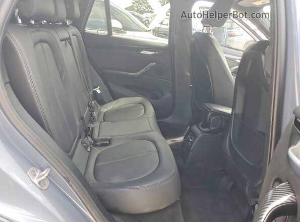 WBXJG7C06L5R36638 2020 BMW X1 Blue Սալոնի հետևի տեսք