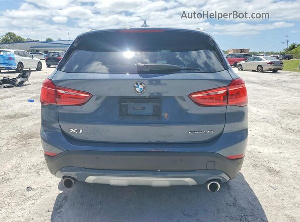 WBXJG7C06L5R36638 2020 BMW X1 Blue Հետևի տեսք