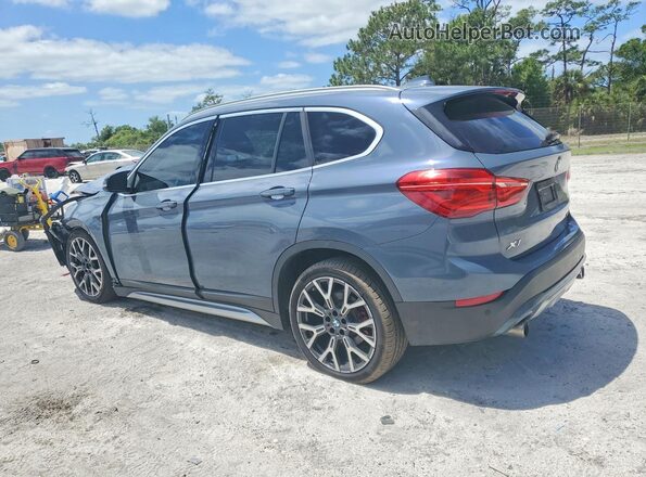 WBXJG7C06L5R36638 2020 BMW X1 Blue Հետևի ձախ