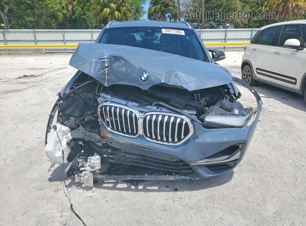 WBXJG7C06L5R36638 2020 BMW X1 Blue Դիմացի տեսք