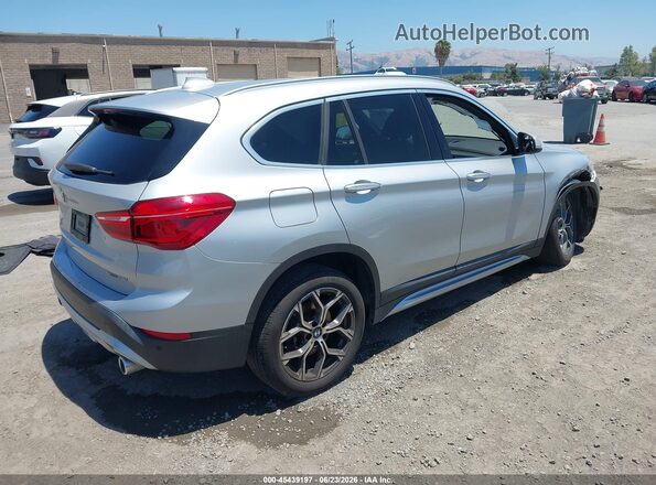 WBXJG7C09M5S82073 2021 BMW X1 Серебряный Задняя правая четверть