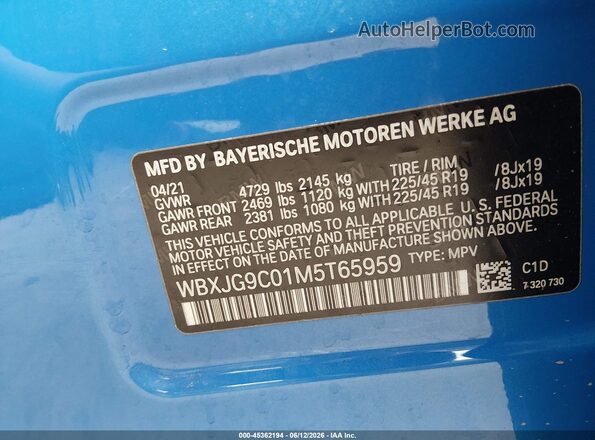 WBXJG9C01M5T65959 2021 BMW X1 Blue Vista del compartimento del motor