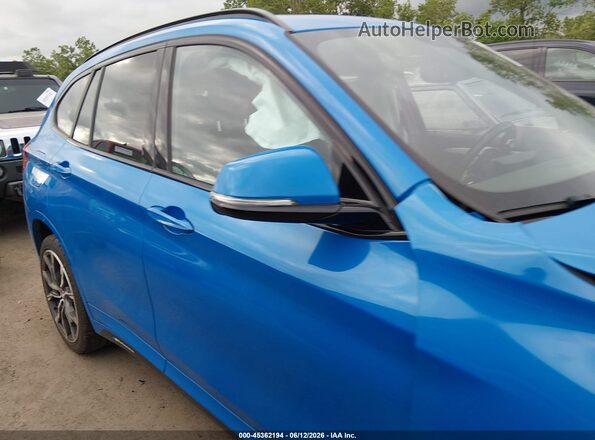 WBXJG9C01M5T65959 2021 BMW X1 Blue Vista interior trasera
