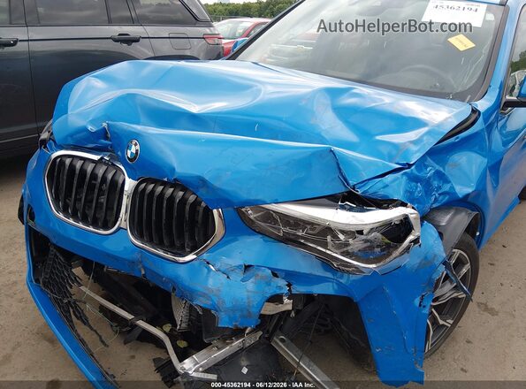 WBXJG9C01M5T65959 2021 BMW X1 Blue Vista trasera
