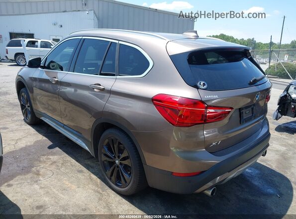 WBXJG9C08L5R21330 2020 BMW X1 Brown Trasero izquierdo
