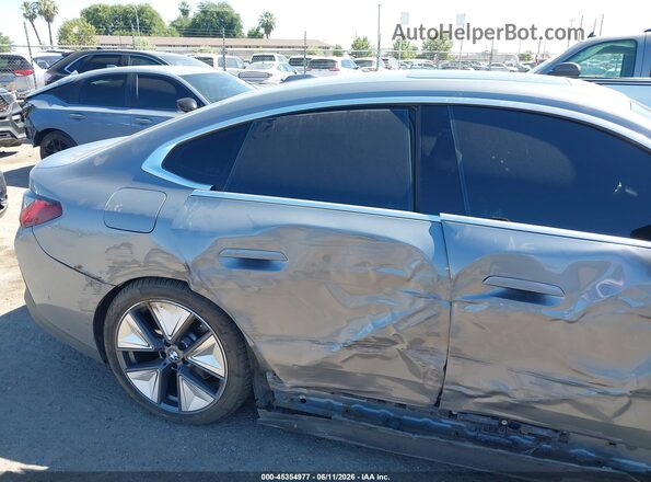 WBY23HD05SFU11479 2025 BMW I4 Gray Սալոնի հետևի տեսք