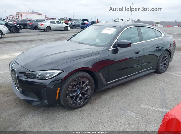 WBY43AW01RFT37730 2024 BMW I4 Black Առջևի ձախ երեք քառորդ տեսարան